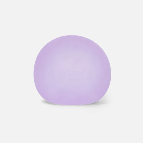 A smooth, light purple Speks stress ball with embossed lettering on a plain white background.