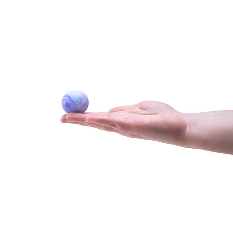 Purple and white marbled Swirl Teenie NeeDoh stress ball held on an open palm to show small size.