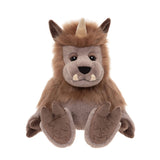 Front view of a plush brown horned monster toy sitting with legs spread, small tusks, and patterned hooves.