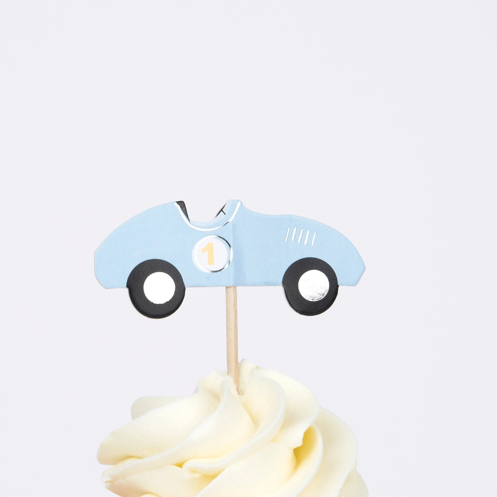 A set of cupcake decorations featuring race car-themed toppers and vibrant wrappers, perfect for adding a speedy touch to birthday treats.