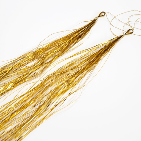 Pair of shimmering gold foil tinsel streamer tassels for balloon arch decorations.