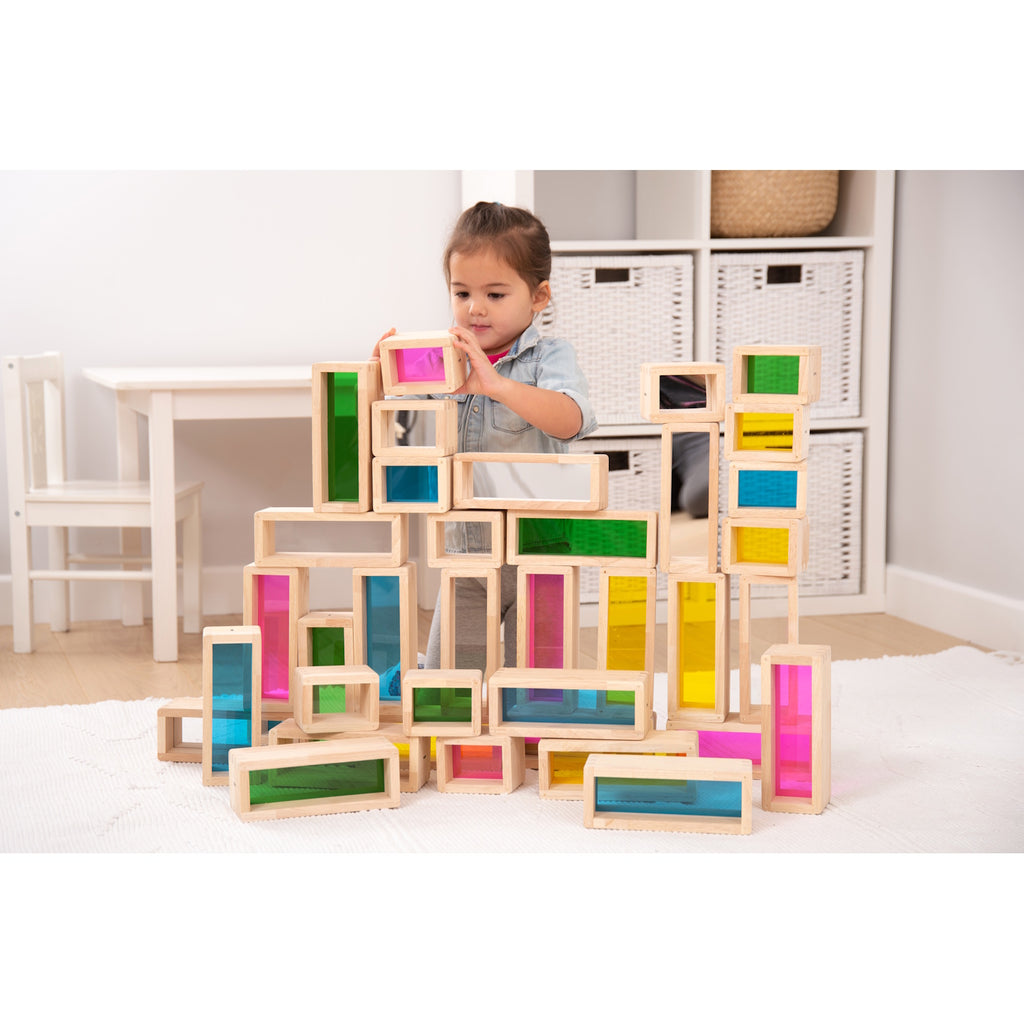 A set of wooden building blocks with translucent colored centers, perfect for construction play, color exploration, and use with light panels.
