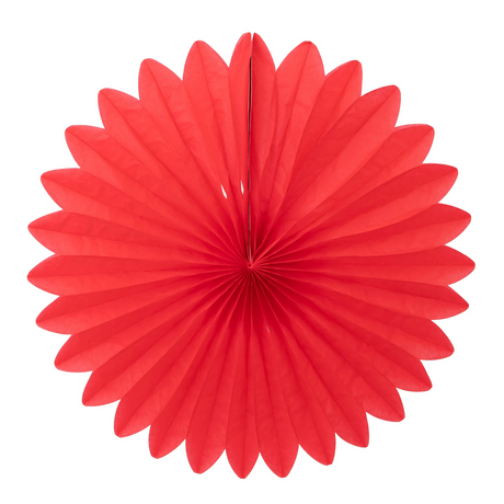 A bright red circular tissue paper fan party decoration on a solid white background.