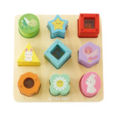 Wooden sensory shape sorter puzzle board with colorful blocks featuring cute illustrations and beads.