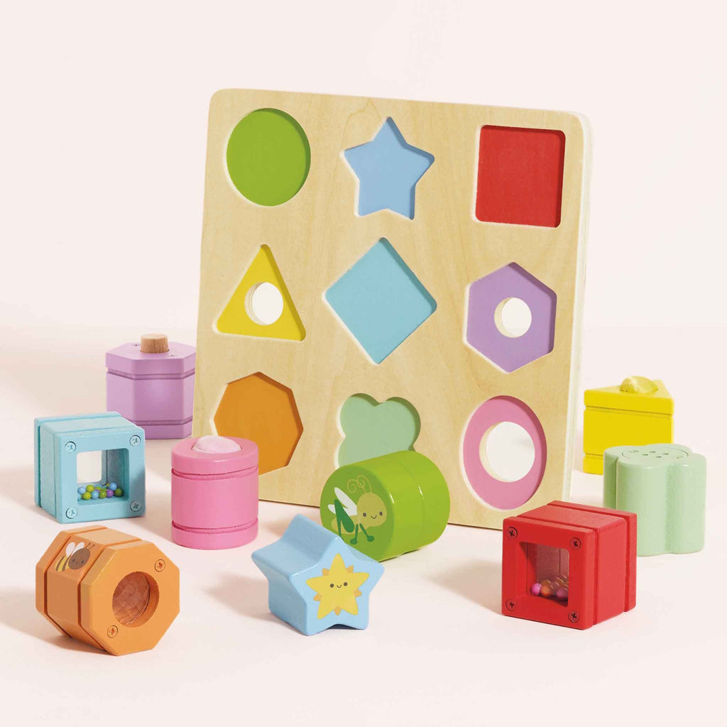 Colorful wooden shape sorting toy featuring various geometric shapes and cute animal designs on a light wood base.