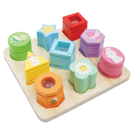 Wooden rainbow sensory shape sorter tray featuring colorful blocks with animals and patterns.