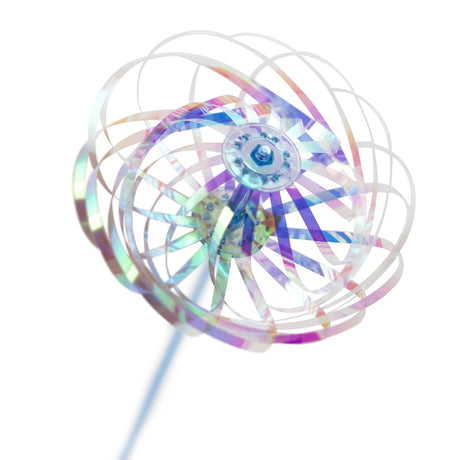 A holographic pinwheel with translucent, iridescent blades creates a kaleidoscope effect. It is set against a plain white background, evoking playfulness.