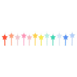 A row of 12 star-shaped birthday candles arranged in a rainbow gradient against a white background.