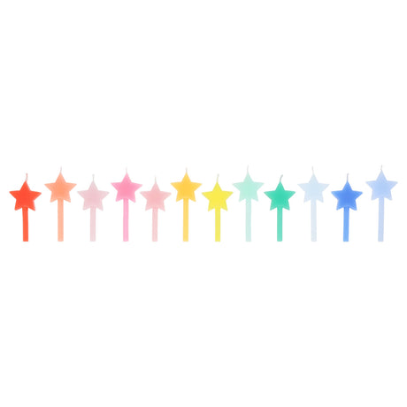 A row of 12 star-shaped birthday candles arranged in a rainbow gradient against a white background.
