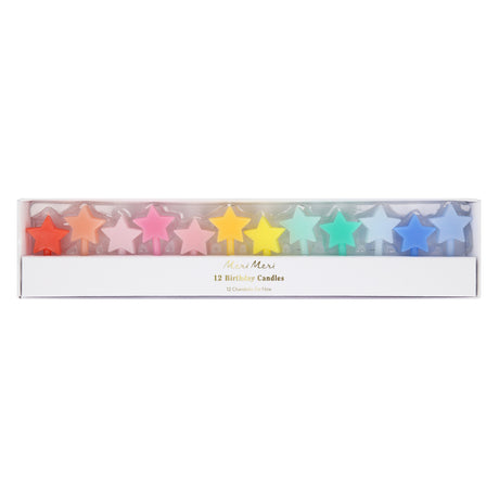 Boxed set of 12 Meri Meri star-shaped birthday candles arranged in a rainbow gradient.