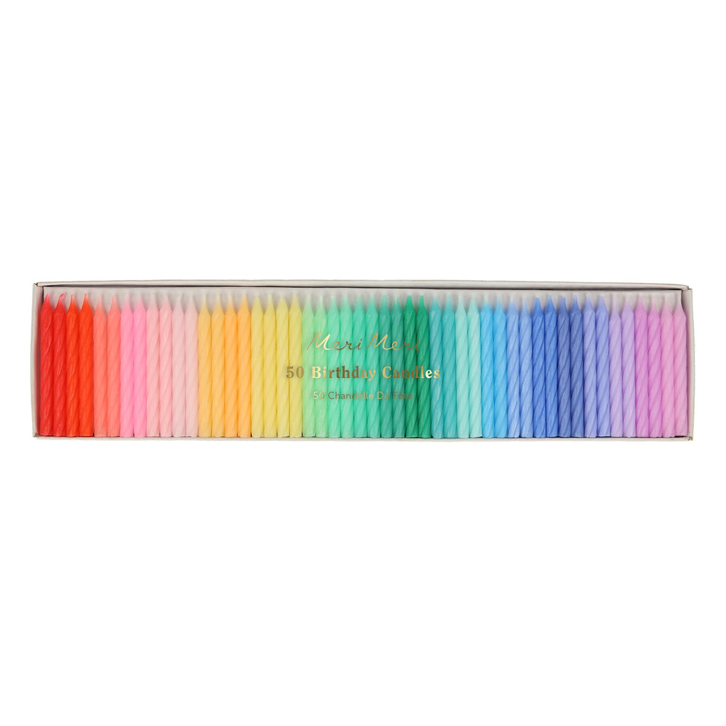 A set of colorful spiral candles in a rainbow palette, perfect for decorating cakes and celebrations.