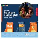 Packaging for Kidoki animal squeeze flashlights featuring fox, owl, and bear designs.