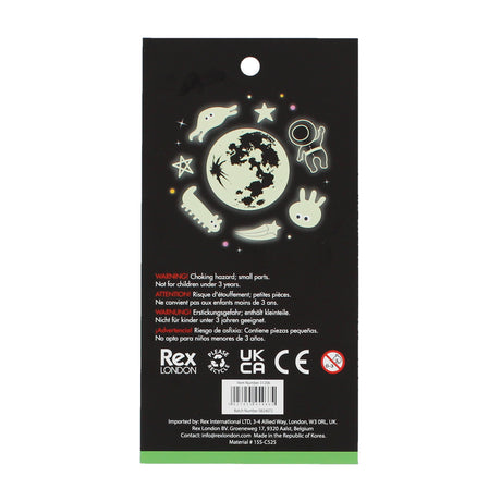 Glow-in-the-dark stickers package, featuring celestial and space-themed designs like stars, planets, and an astronaut on a black background. Warning: small parts.