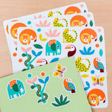 Colorful sticker sheets with playful jungle animals like elephants, lions, toucans, and butterflies on a light wooden surface, conveying a fun and lively tone.