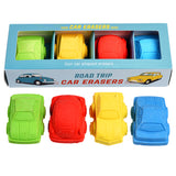 A set of colorful car-shaped erasers in a box labeled "Road Trip Car Erasers." Includes green, red, yellow, and blue erasers arranged in rows.