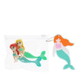 Two small mermaid figurines, one with red hair and the other blonde, lie inside a clear pouch. A cartoon mermaid keychain with orange hair hangs beside it.