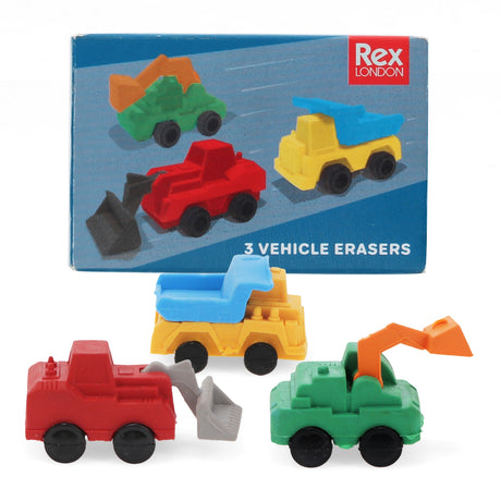 Toy vehicle erasers in red, yellow, and green are on display in front of their packaging. Each eraser is a different construction vehicle. Packaging reads: "Rex London - 3 Vehicle Erasers."