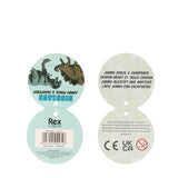 Circular product label with dinosaurs and text. Left side features a dinosaur graphic with "DINOSAUR JUMBO PENCIL & SHARPENER." Right side has product details and warnings.