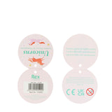 Round product tag for a jumbo pencil and sharpener featuring colorful unicorns on pastel background. Displays brand, barcode, and safety warnings. Playful and whimsical tone.