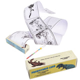 A long paper roll with black-and-white dinosaur illustrations and games, partially unfurled. A colorful pencil lies beside two "Prehistoric Land" boxes.