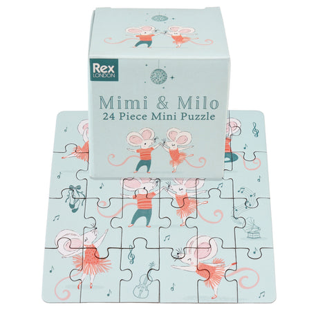 Puzzle featuring dancing mice in red outfits on a pale blue background. The box, labeled “Mimi & Milo,” showcases playful and joyful vibes.