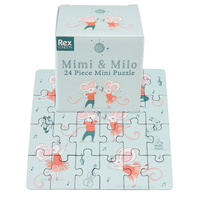 Puzzle featuring dancing mice in red outfits on a pale blue background. The box, labeled “Mimi & Milo,” showcases playful and joyful vibes.