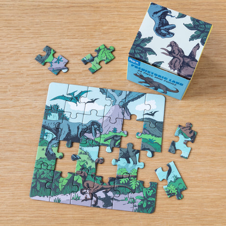 Rex London Prehistoric Land 24-piece mini jigsaw puzzle for kids with dinosaur illustrations and matching box.