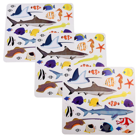 Stickers of sea life including sharks, fish, seahorses, and starfish on white sheets. Colorful and playful, these designs evoke oceanic wonder.
