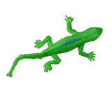 Bright green plastic lizard toy with textured skin, facing upwards. It has a vivid blue stripe along its back, lying on a white background.