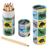 A colorful set of colored pencils in a dinosaur-themed cylindrical case. The case is decorated with various dinosaur illustrations and names. A single wooden pencil lies next to the case. Vibrant and playful.