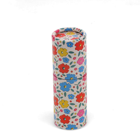 Floral-patterned cylindrical container with colorful red, yellow, blue, and pink flowers. Vibrant and whimsical on a white background.