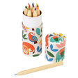 A set of colored pencils in a cylindrical container decorated with colorful animal illustrations like parrots and lions, conveying a playful tone.