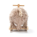 Plush fuzzy woolly mammoth rocking horse toy with wooden handles and runners.