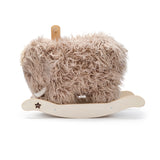 Plush woolly mammoth rocking horse toy with a wooden base.