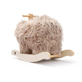 Plush mammoth rocking horse toy with fluffy beige faux fur and a wooden base.
