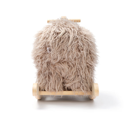 Plush beige woolly mammoth rocking horse toy with wooden base and handles, back view on white background.