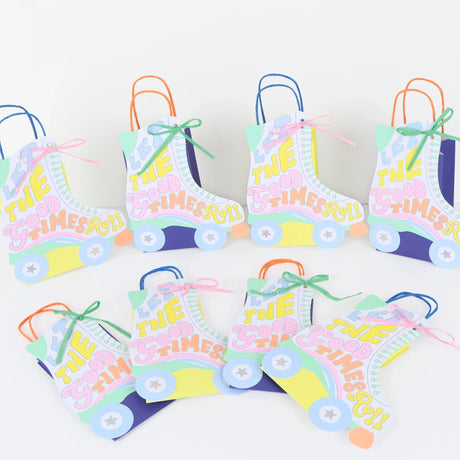 Retro roller skate party favor bags with "Let the Good Times Roll" text in pastel colors for a roller disco theme.