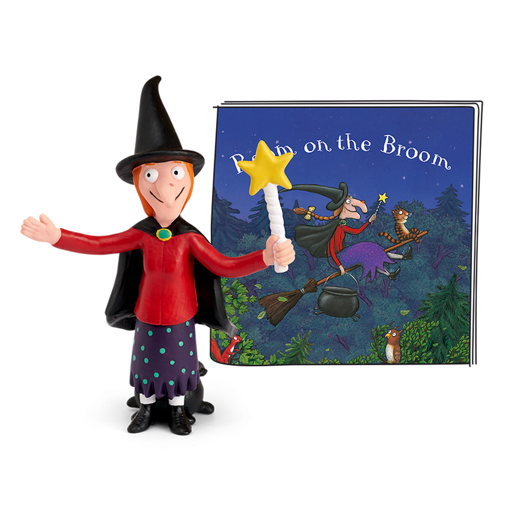A cartoonish witch with a red top, polka-dotted skirt, and a black cape holds a star-tipped wand, smiling and gesturing.