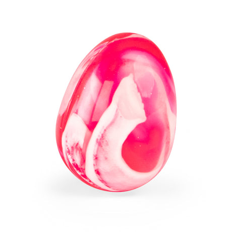 Pink and white marbled egg shaped stone bouncy ball or crystal on a clean white background.