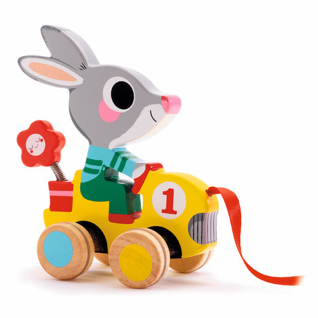 Wooden bunny pull toy riding a yellow car with a flower, perfect for toddler developmental play.