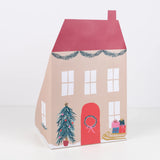 Closed Santa's house pop-up advent calendar featuring a red roof and painted house exterior.