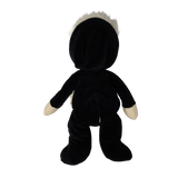 Back view of a plush blonde doll wearing a hooded black skeleton suit.