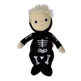 Plush blonde doll in a black skeleton suit with arms outstretched and feet crossed.