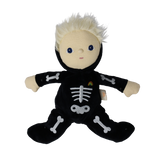 Plush blonde doll in a black skeleton suit sitting with arms and legs spread wide open.