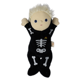 Plush blonde doll in a black skeleton suit with both arms raised straight up in the air.