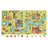 Illustrated picnic scene with animals and people enjoying food by a winding river. Vibrant, busy atmosphere with 10 hidden jelly desserts to find.