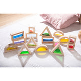 A set of wooden blocks with different textures, sounds, and visual elements, designed to engage children's senses and support early development.