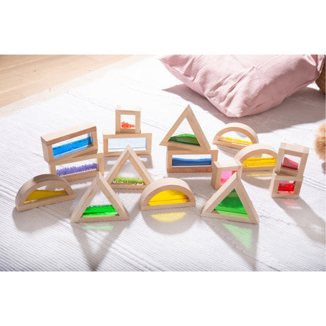 A set of wooden blocks with different textures, sounds, and visual elements, designed to engage children's senses and support early development.