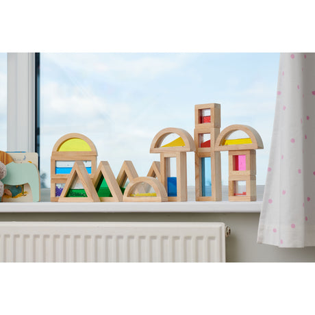 A set of wooden blocks with different textures, sounds, and visual elements, designed to engage children's senses and support early development.