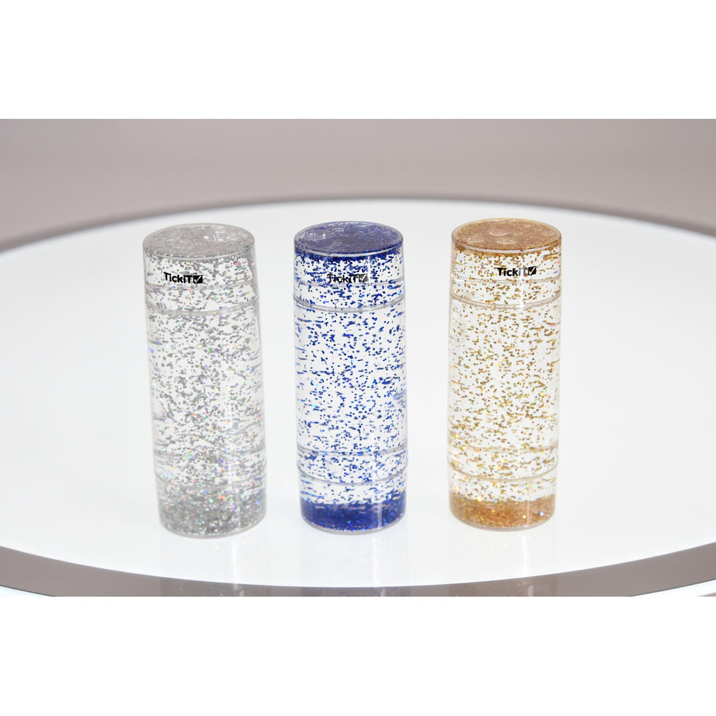 A collection of clear tubes filled with swirling glitter in vibrant colors, designed to provide visual stimulation and calming sensory input.